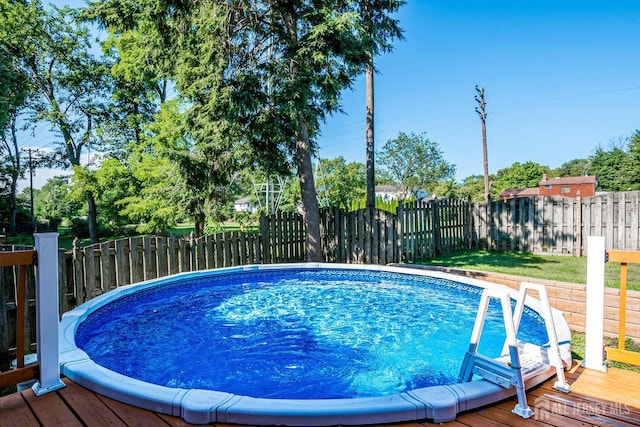 view of pool featuring a wooden deck