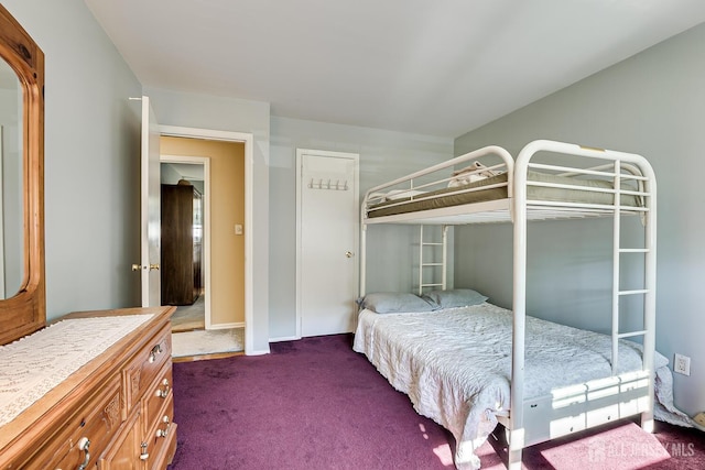 bedroom with dark colored carpet