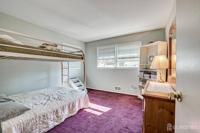 bedroom with dark carpet