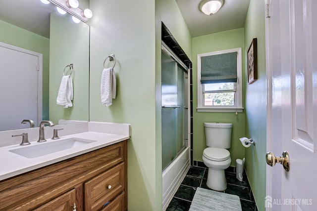 full bathroom with toilet, vanity, tile patterned floors, and enclosed tub / shower combo