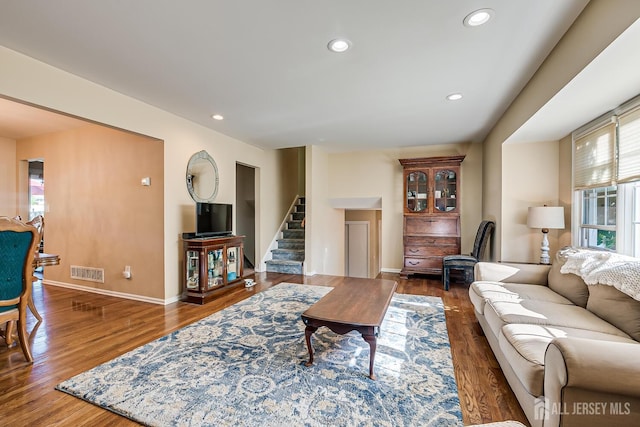 living room featuring dark hardwood / wood-style floors