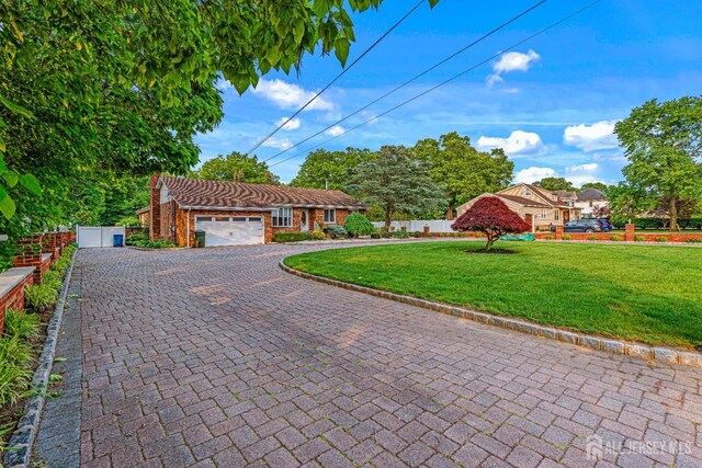 34 Brookside Ave, Old Bridge, NJ 08857 - view of front of property with decorative driveway and an attached garage