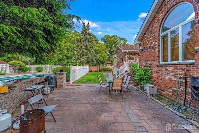34 Brookside Ave, Old Bridge, NJ 08857 - fenced backyard featuring a patio and outdoor dining area