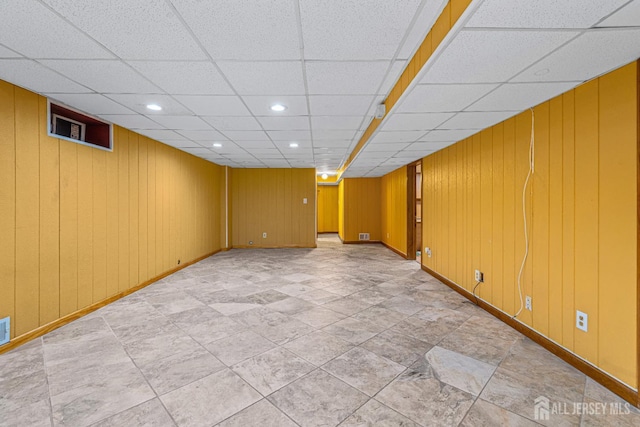 34 Brookside Ave, Old Bridge, NJ 08857 - empty room with a drop ceiling, baseboards, wooden walls, and recessed lighting