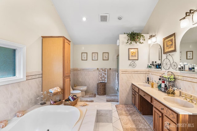 34 Brookside Ave, Old Bridge, NJ 08857 - full bath with vaulted ceiling, tile walls, a bidet, a shower stall, and double vanity