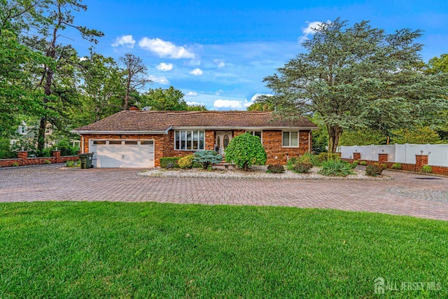 34 Brookside Ave, Old Bridge, NJ 08857 - ranch-style house with decorative driveway, an attached garage, and brick siding