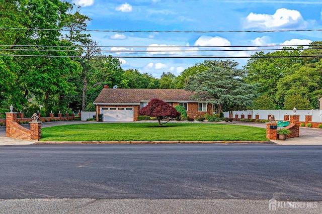 34 Brookside Ave, Old Bridge, NJ 08857 - view of front of house with view of wooded area, a garage, and driveway