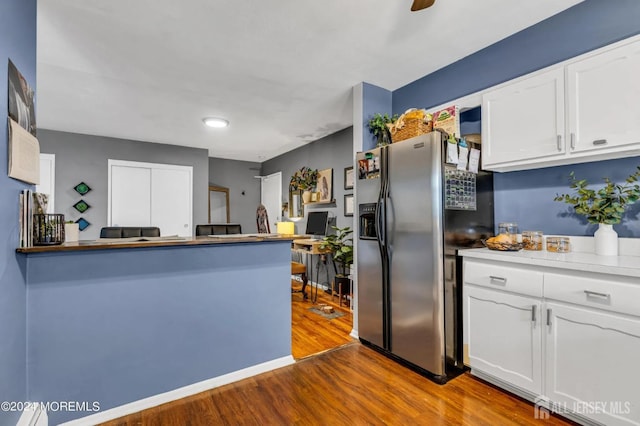 32 Woodedge Ave Unit 5, Edison, NJ 08817 - kitchen with stainless steel refrigerator with ice dispenser, dark wood finished floors, white cabinetry, a peninsula, and light countertops