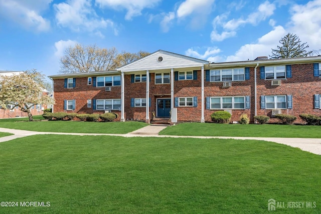 32 Woodedge Ave Unit 5, Edison, NJ 08817 - neoclassical home featuring a front lawn and brick siding