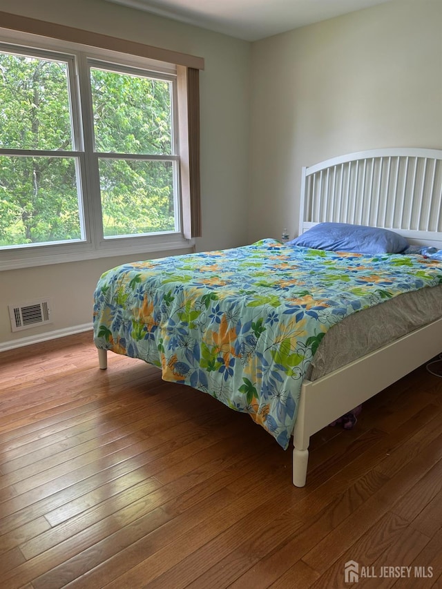 6 Quaker St, Edison, NJ 08820 - bedroom with wood-type flooring and baseboards