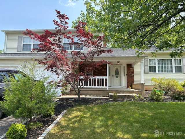 6 Quaker St, Edison, NJ 08820 - view of front of house featuring covered porch and a front yard