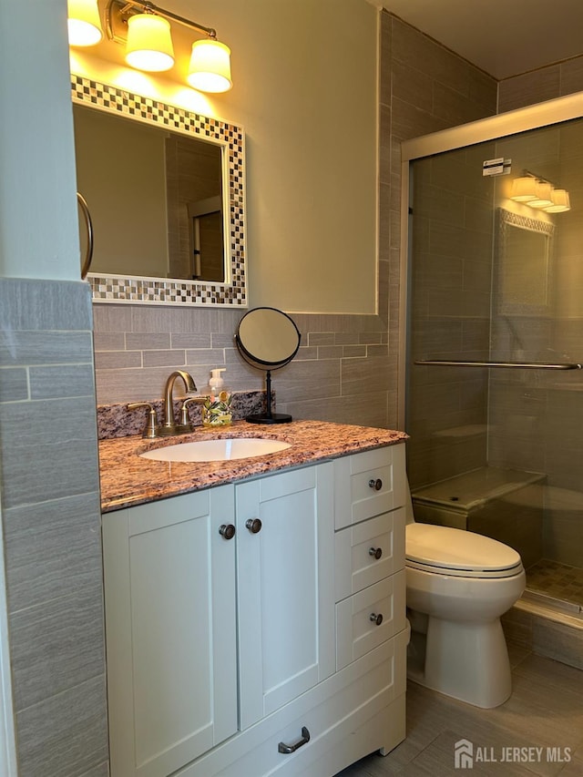 6 Quaker St, Edison, NJ 08820 - full bath featuring vanity, a shower stall, tile walls, and tile patterned flooring