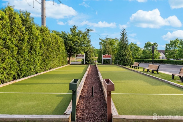 view of tennis court with a bocce ball area
