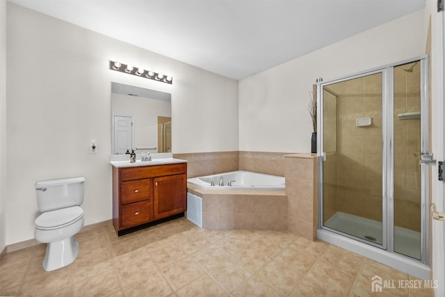 full bathroom featuring a shower stall, vanity, tile patterned flooring, a garden tub, and toilet