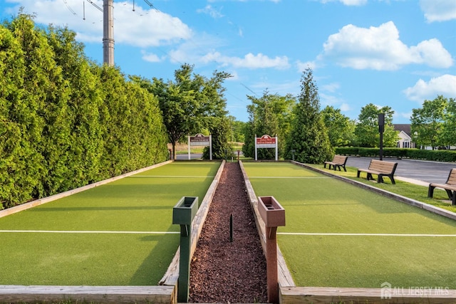 view of tennis court featuring a bocce ball area