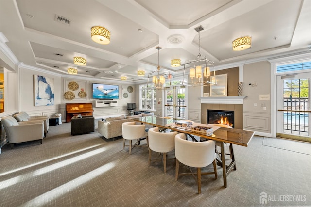 common area with a decorative wall, coffered ceiling, crown molding, and beamed ceiling