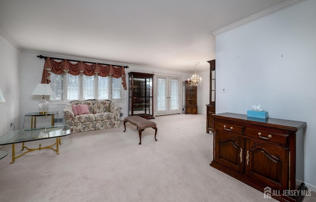 carpeted living room featuring crown molding, french doors, and a notable chandelier