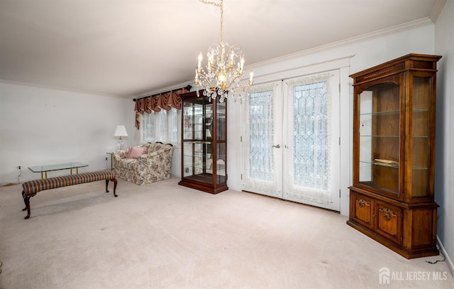 sitting room featuring light carpet, an inviting chandelier, ornamental molding, and french doors