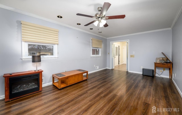 interior space with dark wood-type flooring, plenty of natural light, and crown molding