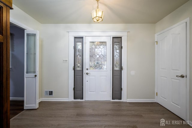 foyer featuring dark hardwood / wood-style floors