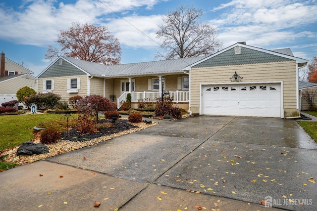 single story home featuring a porch and a garage