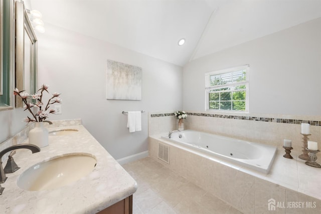 841 Harrell Ave, Woodbridge Proper, NJ 07095 - bathroom with double vanity, a jetted tub, vaulted ceiling, and tile patterned floors