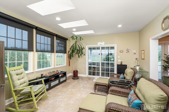 9 Bouvier Ln, South Brunswick, NJ 08816 - living area with a skylight, light tile patterned floors, recessed lighting, and baseboards