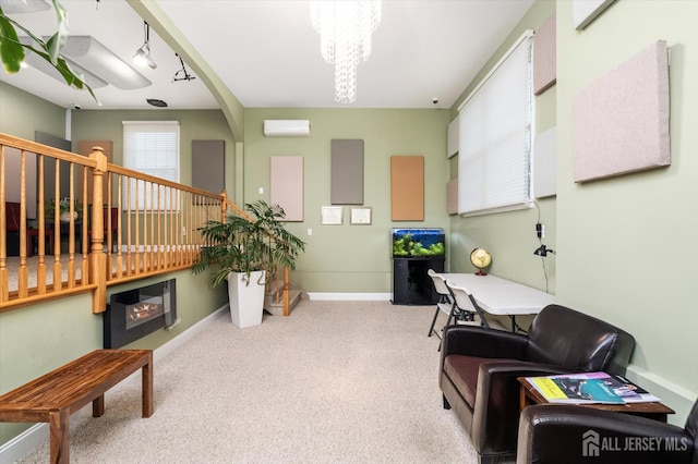 9 Bouvier Ln, South Brunswick, NJ 08816 - sitting room with a chandelier, a wall unit AC, stairs, carpet flooring, and baseboards