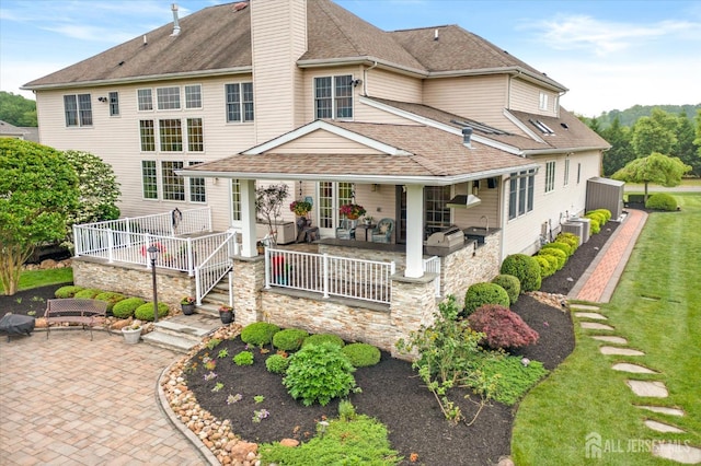 9 Bouvier Ln, South Brunswick, NJ 08816 - back of house with a patio area, cooling unit, a shingled roof, and a chimney