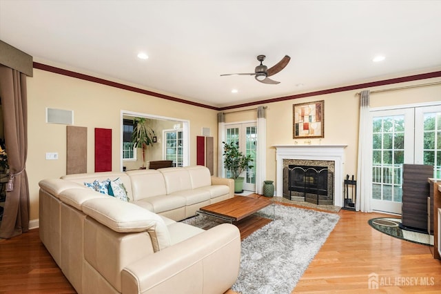 9 Bouvier Ln, South Brunswick, NJ 08816 - living area featuring ceiling fan, light wood finished floors, plenty of natural light, crown molding, and recessed lighting