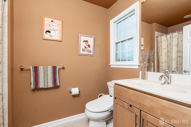 9 Bouvier Ln, South Brunswick, NJ 08816 - bathroom with toilet, baseboards, vanity, tile patterned flooring, and a shower with shower curtain