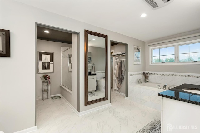 9 Bouvier Ln, South Brunswick, NJ 08816 - full bath featuring marble look tiles, a bath, recessed lighting, a shower, and vanity