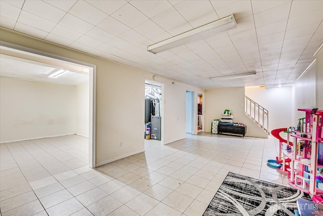 84 Kossuth St, Piscataway, NJ 08854 - below grade area featuring light tile patterned flooring and stairway