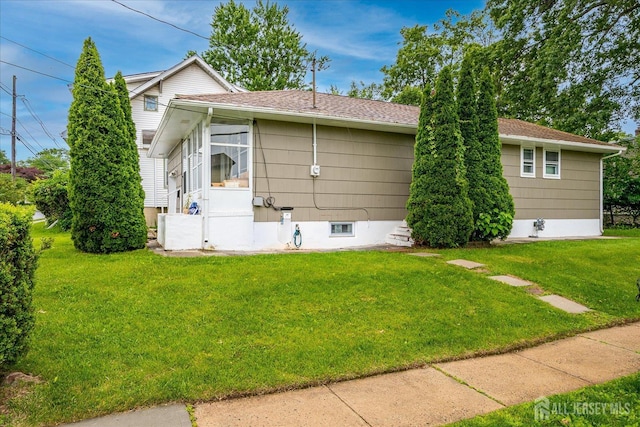 84 Kossuth St, Piscataway, NJ 08854 - view of home's exterior with a lawn and a shingled roof