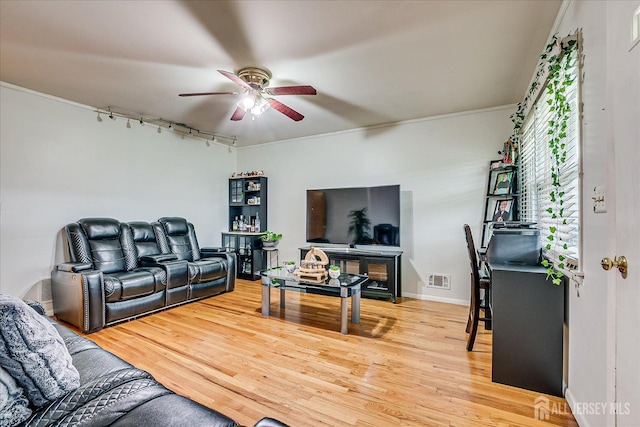 84 Kossuth St, Piscataway, NJ 08854 - living area featuring rail lighting, a ceiling fan, light wood-style flooring, and ornamental molding