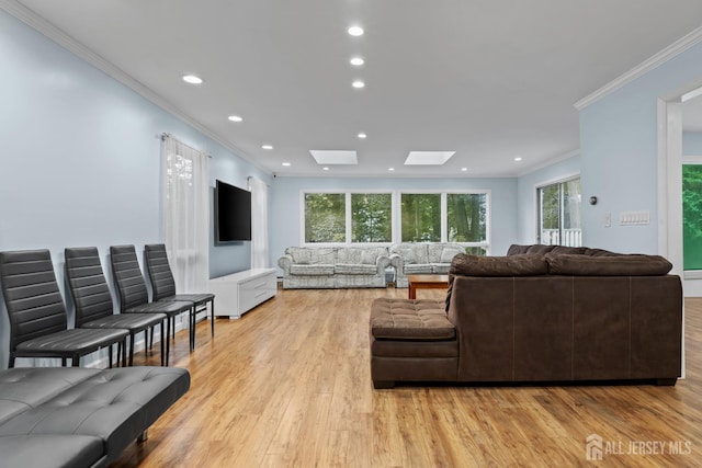 910 Curtis Pl, North Brunswick, NJ 08902 - living room with crown molding, a skylight, light wood finished floors, healthy amount of natural light, and recessed lighting