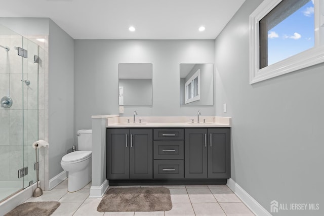 910 Curtis Pl, North Brunswick, NJ 08902 - bathroom with a shower stall, double vanity, tile patterned floors, and recessed lighting
