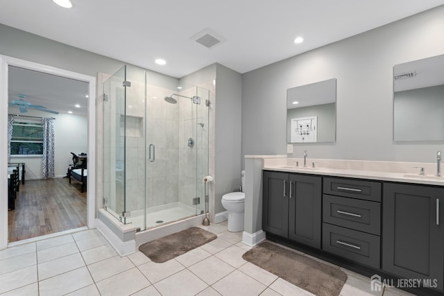 910 Curtis Pl, North Brunswick, NJ 08902 - full bathroom featuring double vanity, a shower stall, tile patterned flooring, recessed lighting, and a ceiling fan