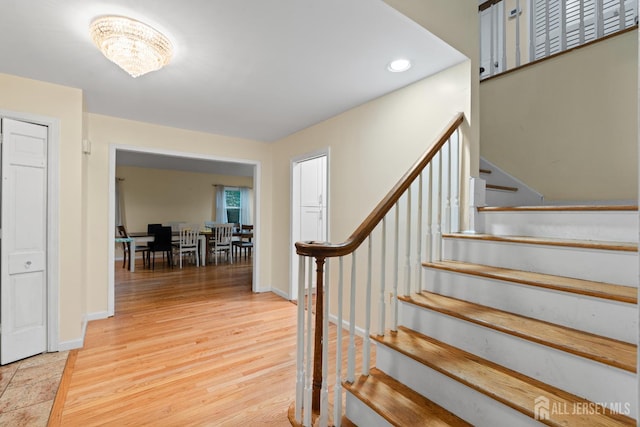 910 Curtis Pl, North Brunswick, NJ 08902 - stairway with a chandelier, wood finished floors, and recessed lighting
