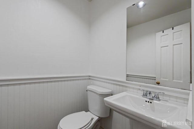 910 Curtis Pl, North Brunswick, NJ 08902 - half bath with a sink and wainscoting