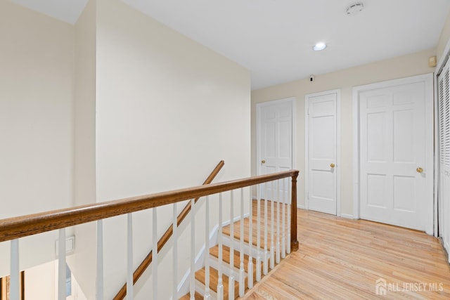 910 Curtis Pl, North Brunswick, NJ 08902 - hallway with an upstairs landing, light wood finished floors, and recessed lighting