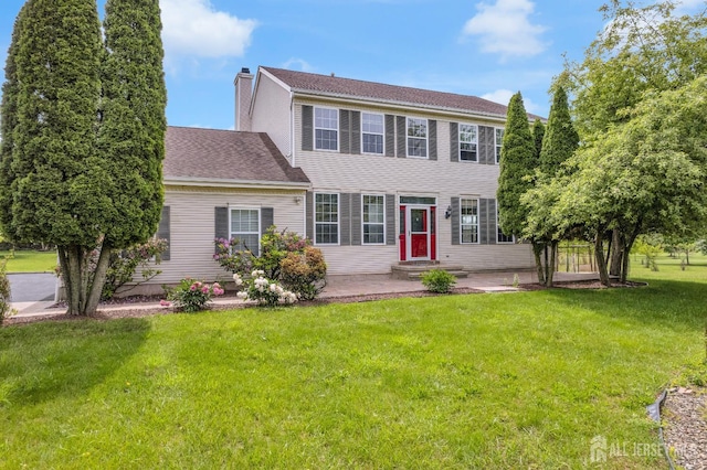 6 Garretson Dr, Franklin, NJ 08823 - colonial-style house with a patio, a chimney, a front yard, entry steps, and a shingled roof