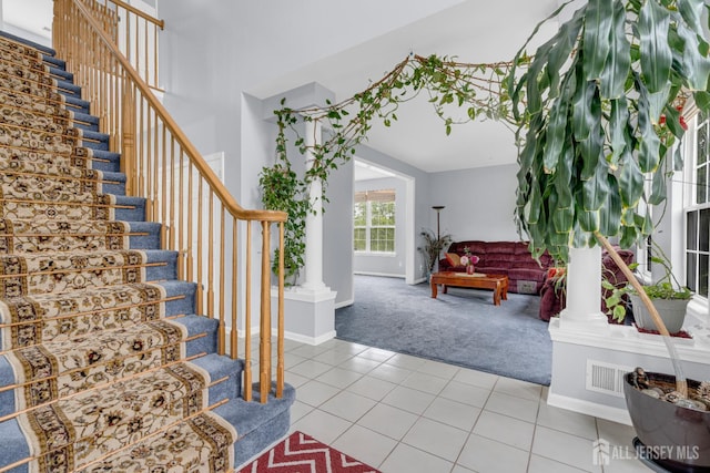 6 Garretson Dr, Franklin, NJ 08823 - carpeted entrance foyer with stairs, tile patterned flooring, baseboards, and decorative columns