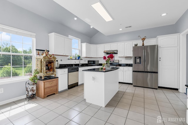 6 Garretson Dr, Franklin, NJ 08823 - kitchen with appliances with stainless steel finishes, under cabinet range hood, tasteful backsplash, white cabinets, and high vaulted ceiling