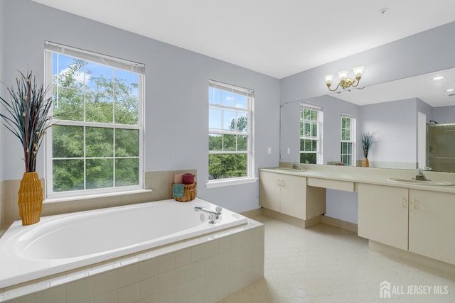 6 Garretson Dr, Franklin, NJ 08823 - full bath with double vanity, a garden tub, plenty of natural light, and a chandelier