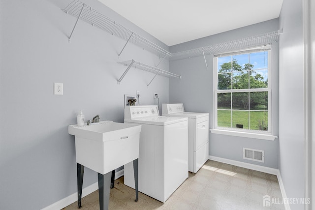 6 Garretson Dr, Franklin, NJ 08823 - laundry room with washing machine and clothes dryer, baseboards, and light floors