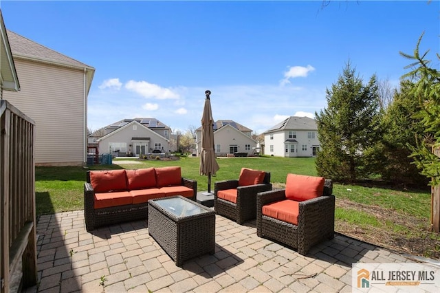 view of patio with an outdoor living space and a residential view