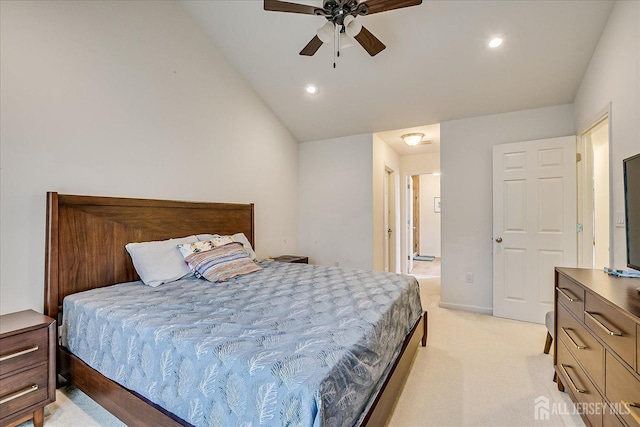 bedroom featuring vaulted ceiling, light carpet, recessed lighting, connected bathroom, and ceiling fan