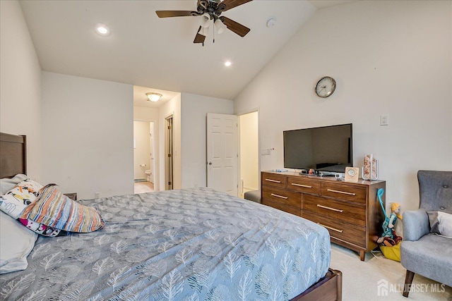 bedroom with vaulted ceiling, light colored carpet, recessed lighting, and connected bathroom