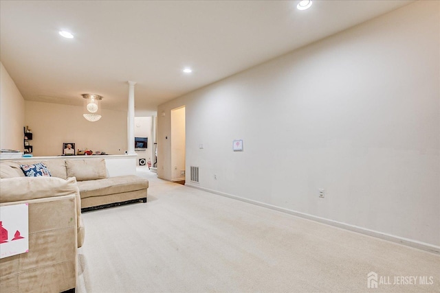 living area with recessed lighting, carpet flooring, and baseboards